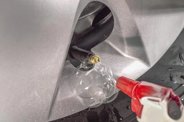Tire valve being replaced