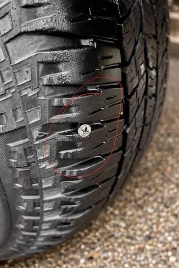 Screw stuck in a tire tread